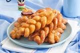 Koeksisters are a sticky, crunchy donut sweet treat that is popular across South Africa. More specifically, they have a crunchy outside crust with a sticky, almost liquid syrup sensation in the centre.

https://www.biltongplus.co.nz/koeksisters/
