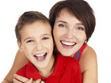 laughing young mother with son 8 year old, St Albans Orthodontic Practice, St Albans