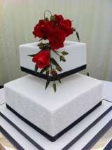 Red sugar roses and piped embroidery from £250 Sharon Lord Cakes Fiddlers Field Croydon Road 