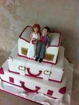 Stacked suitcases with handmade bride and groom from £410 Sharon Lord Cakes Fiddlers Field Croydon Road 
