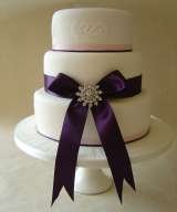 3 tier with satin ribbon and brooch from £325 Sharon Lord Cakes Fiddlers Field Croydon Road 