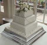 Square cake with quilted side pattern and sugar roses from £385 Sharon Lord Cakes Fiddlers Field Croydon Road 