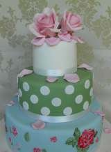 3 tier vintage style with hand painted bottom tier and large sugar rose from £385