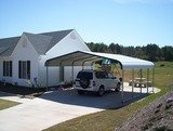 A metal carport from Bargain Barns USA provides sun protection for your vehicle.