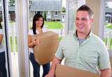 Young Attractive Couple Moving Into Their New Home