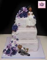 Handmade sugar models and flower embellishments wedding cake