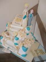 Romantic wedding cake with handmade sugar figures and embellishments 