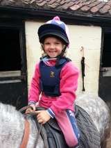 One very happy little customer......her first ride on her formerly un-rideable pony