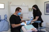 Oakville dentist Dr. Jacobs and dental hygienist performing root canal at Jacobs & Associates Dental Office Jacobs & Associates Dental Office 1060 Speers Road Suite 218 