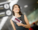 Woman on a business travel holding passport 