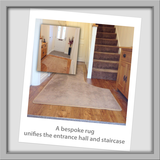 This entrance way has that added touch of luxury with a made to measure rug using the same carpet as the stairs. The rug curves around the stairs to give a chic design finish.