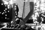 a cool male dj on the turntables