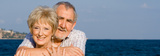 happy smiling elderly seniors loving couple on vacation Calbranch Insurance Agency 264 North St 