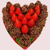 Dark Chocolate dipped fresh strawberries topped in caramel morsels and arranged in shape of a heart.