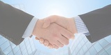 Handshake with modern skyscrapers as background, Business Loan & Line of Credit, Dallas