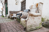 Old abandoned furniture on narrow street of Izmir, Turkey