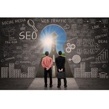 Business partners and SEO doodle on blackboard with success road view