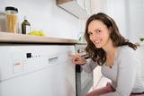 Happy Woman Opening Dishwasher In Kitchen Room, Appliance Repair Experts ASAP, Hoffman Estates
