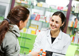 pharmacist suggesting medical drug to buyer in pharmacy drugstore